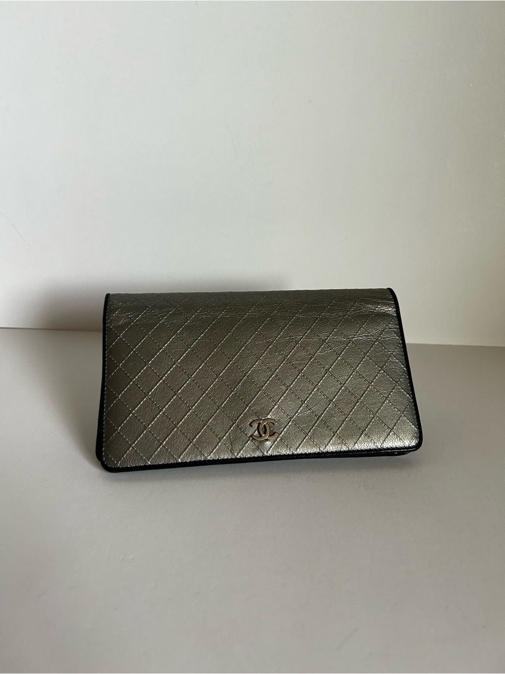 CHANEL Quilted Metallic Silver Clutch with Black Trim